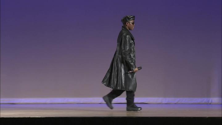 Participant on Stage performing.